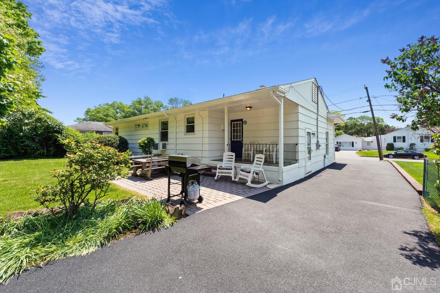 76 Orchard Road Middlesex, NJ 08846 - Photo 27 of 31 a view of a house with backyard sitting area and garden