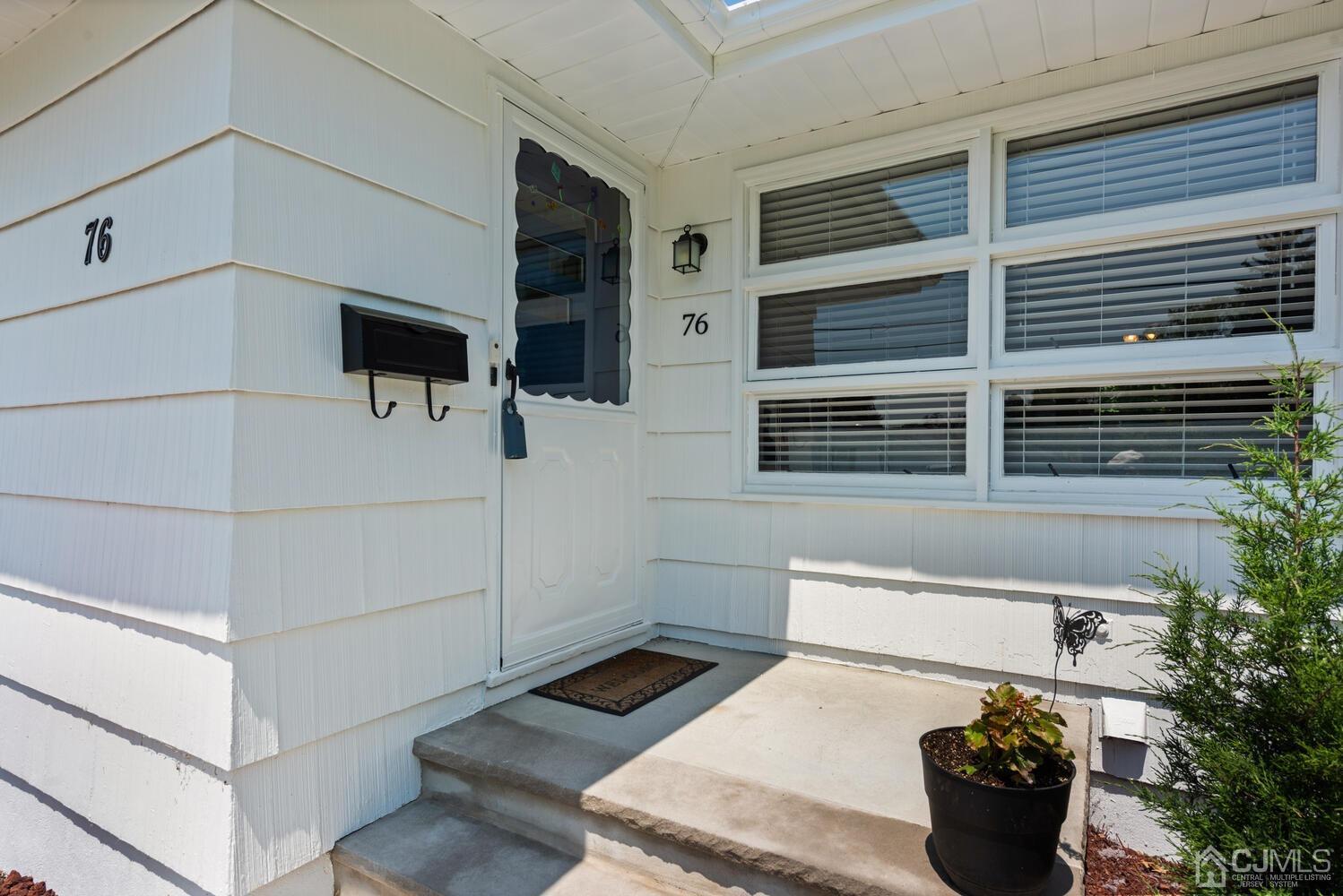 76 Orchard Road Middlesex, NJ 08846 - Photo 4 of 31 a kitchen with a sink and potted plant