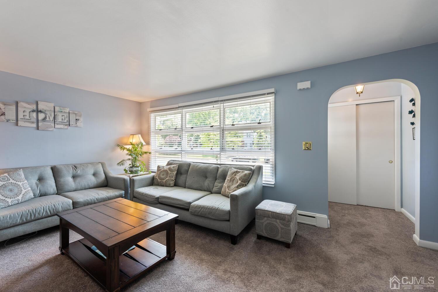 76 Orchard Road Middlesex, NJ 08846 - Photo 6 of 31 a living room with furniture and a large window