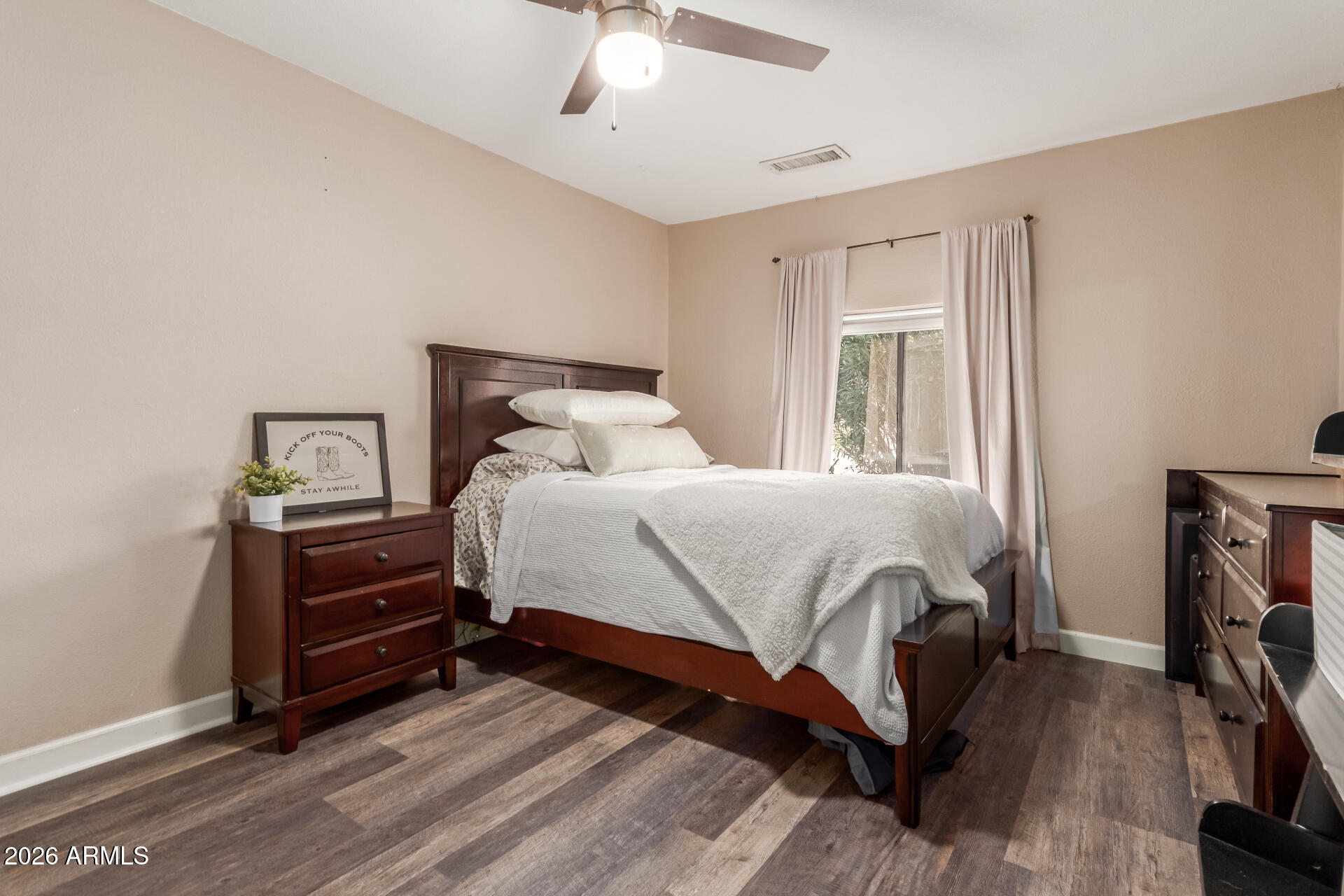 313 West Saddle Mountain Road Phoenix, AZ 85086 - Photo 27 of 54 a bedroom with a bed and a tv on table
