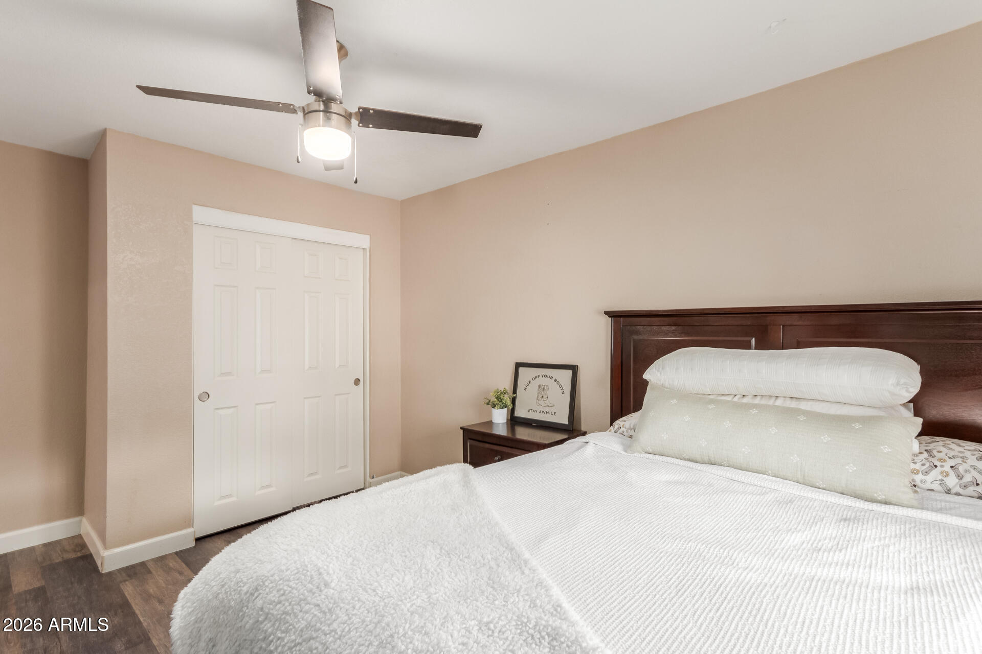 313 West Saddle Mountain Road Phoenix, AZ 85086 - Photo 28 of 54 a bedroom with a bed and a chandelier