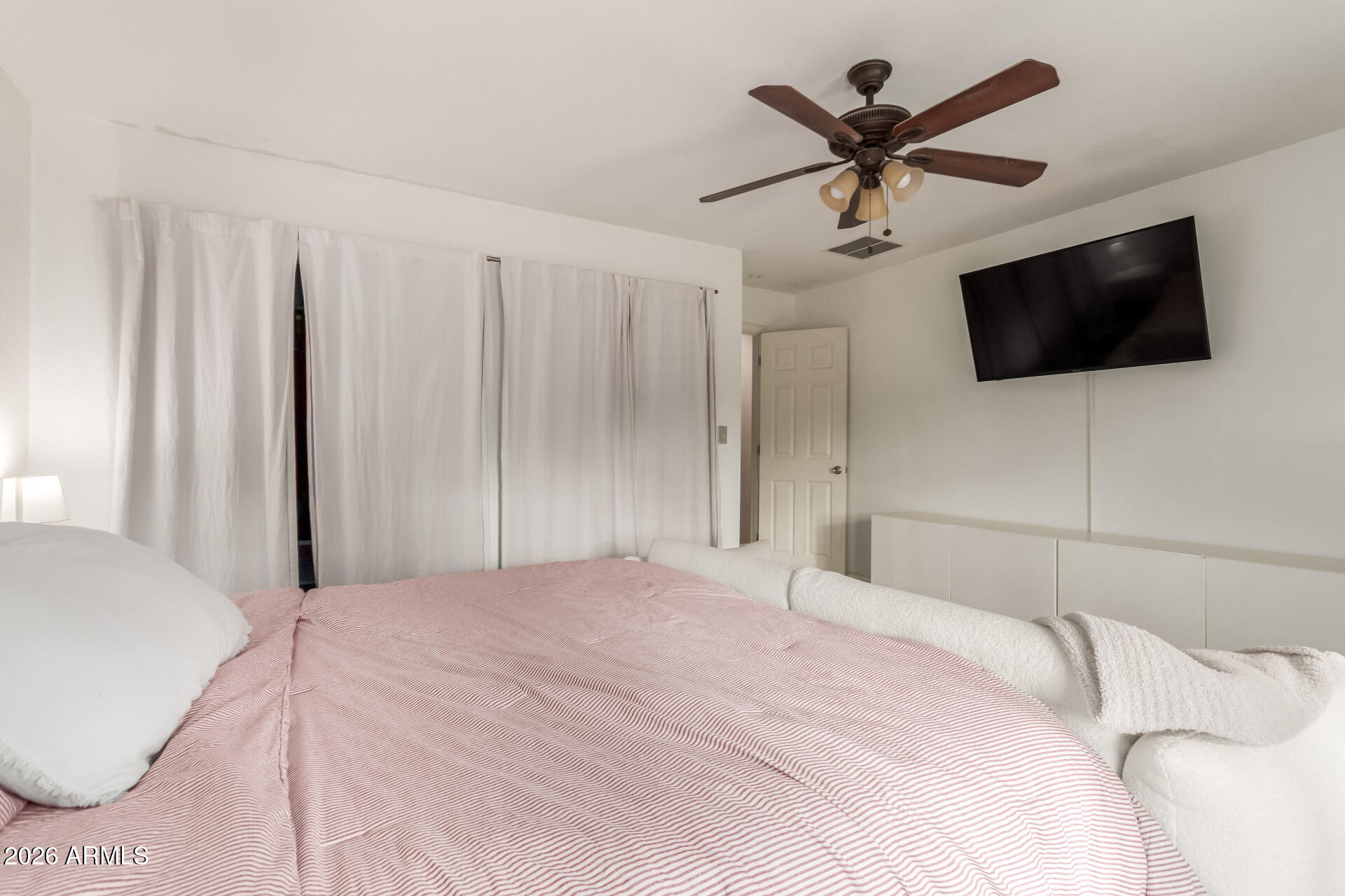 313 West Saddle Mountain Road Phoenix, AZ 85086 - Photo 32 of 54 a bedroom with a large bed and a flat screen tv