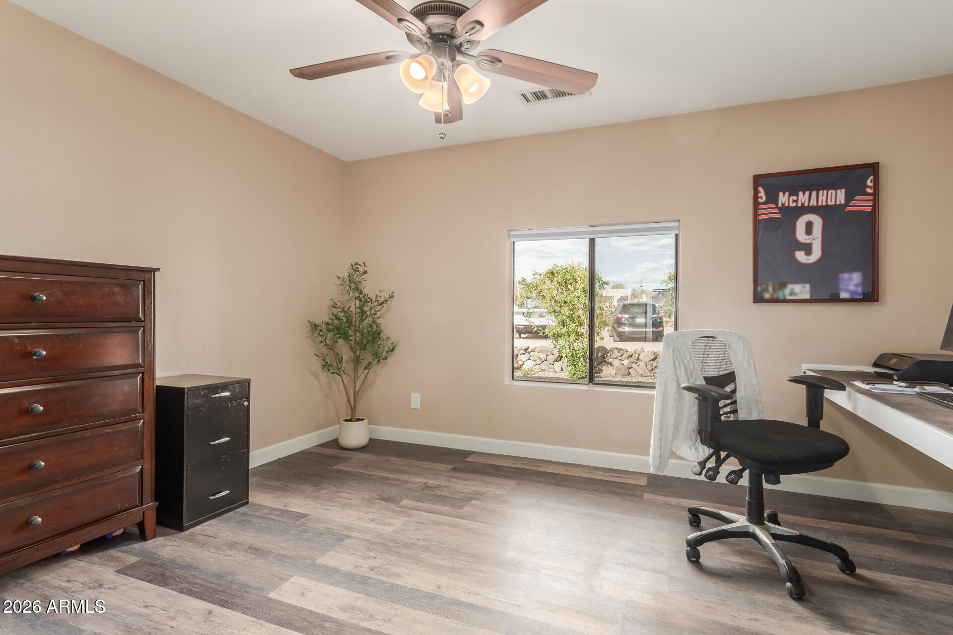 313 West Saddle Mountain Road Phoenix, AZ 85086 - Photo 34 of 54 a view of a workspace with furniture and a window