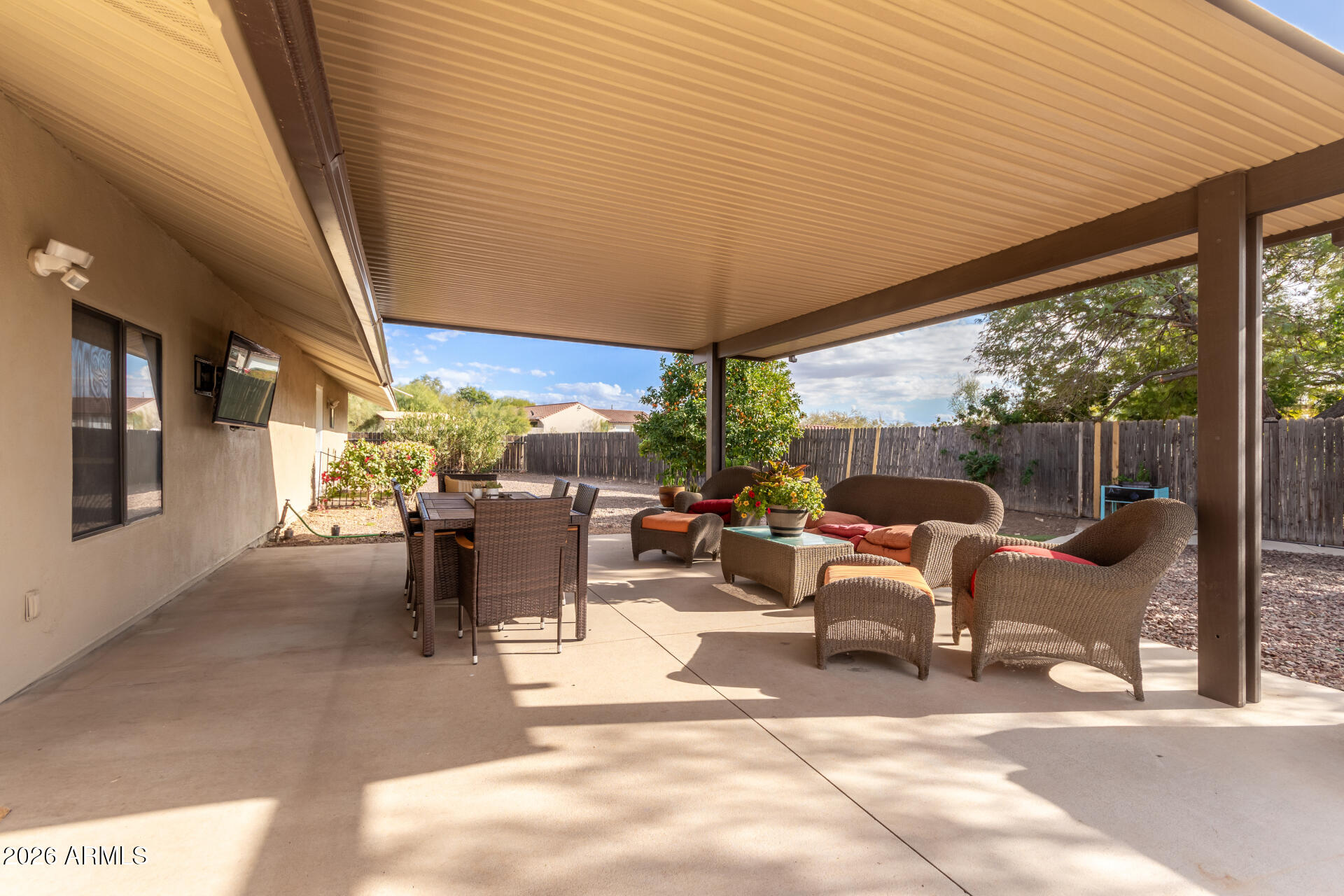 313 West Saddle Mountain Road Phoenix, AZ 85086 - Photo 38 of 54 a view of a patio with a table and chairs and potted plants