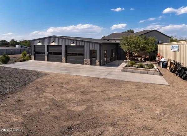 a view of a swimming pool with some potted plants