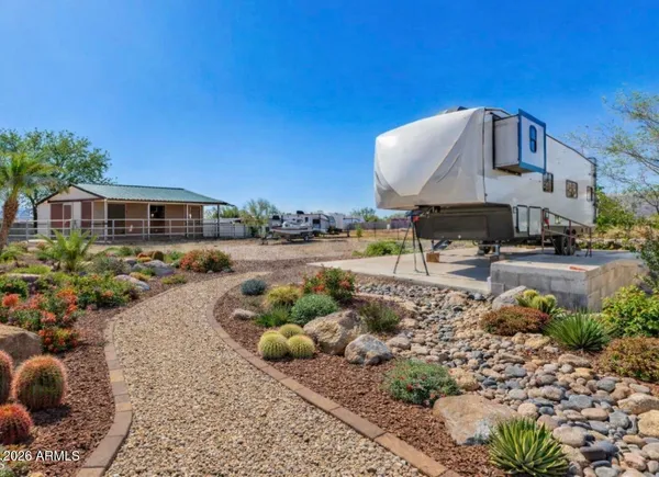 a view of a wrought iron fences in front of house