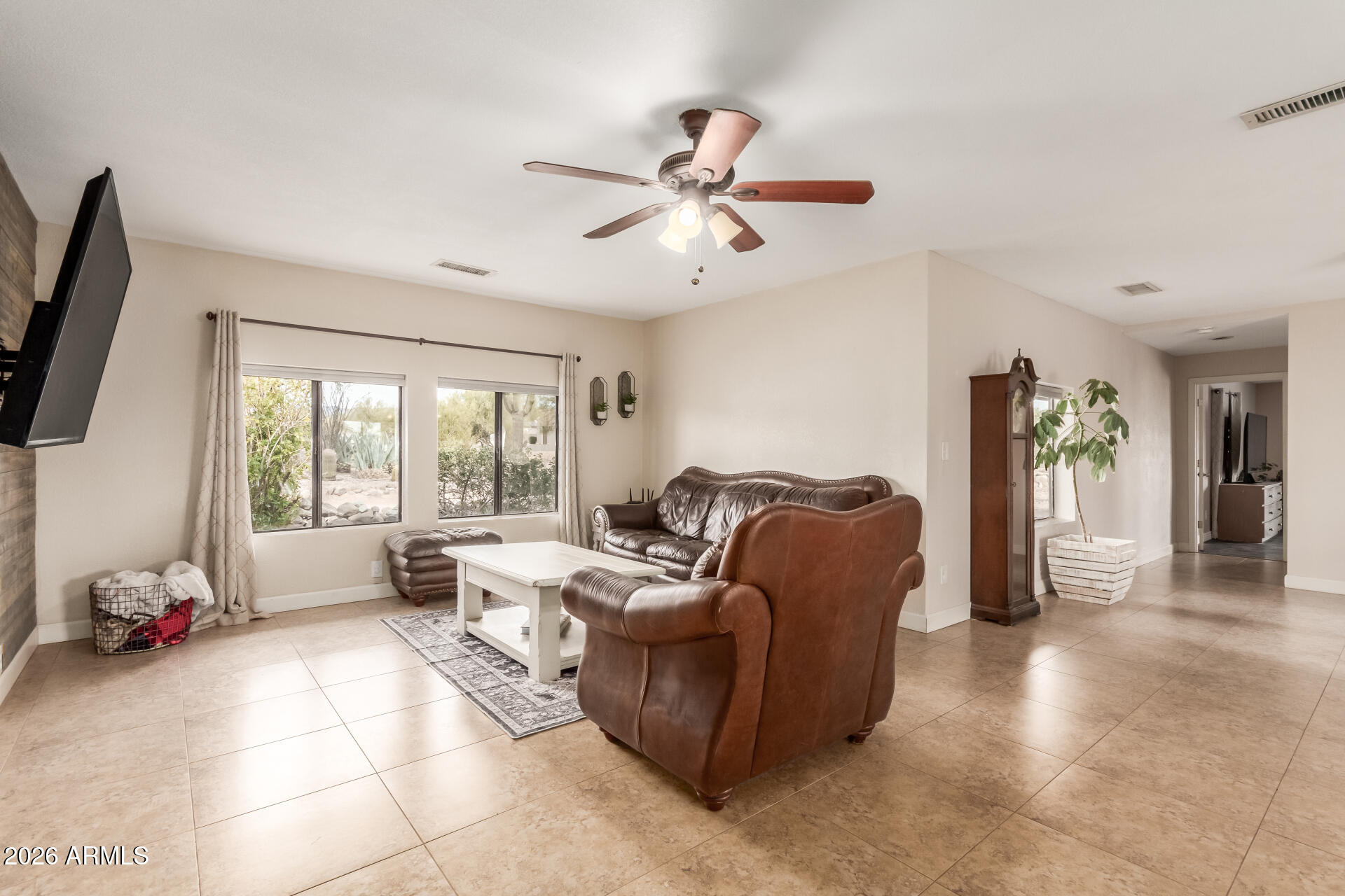 313 West Saddle Mountain Road Phoenix, AZ 85086 - Photo 7 of 54 a living room with furniture and a large window