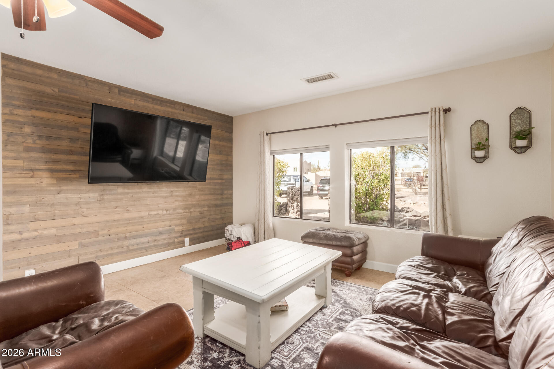 313 West Saddle Mountain Road Phoenix, AZ 85086 - Photo 9 of 54 a living room with furniture and a flat screen tv