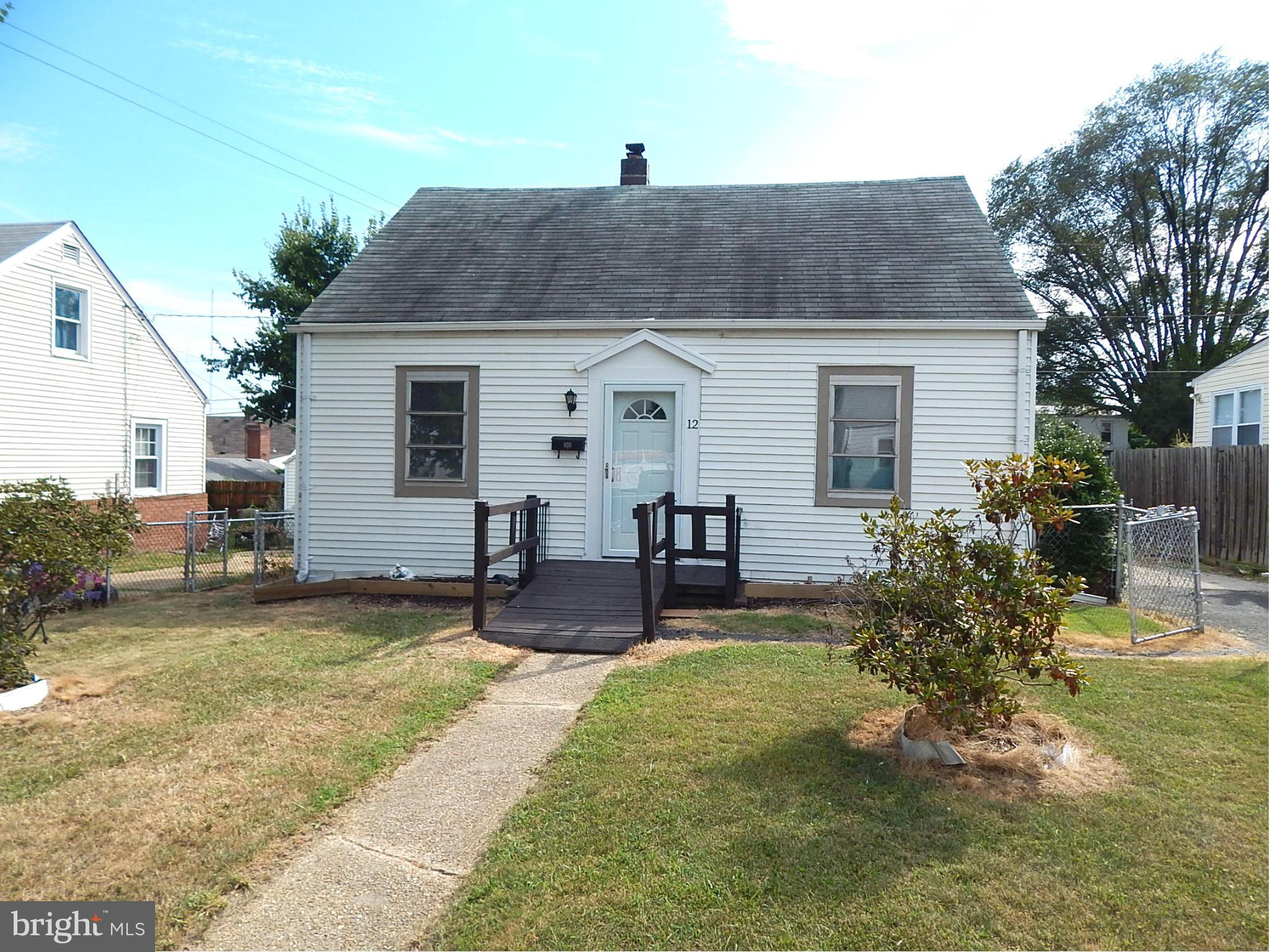 12 Crafton Road Baltimore, MD 21221 - Photo 1 of 28 a front view of house with yard and seating area