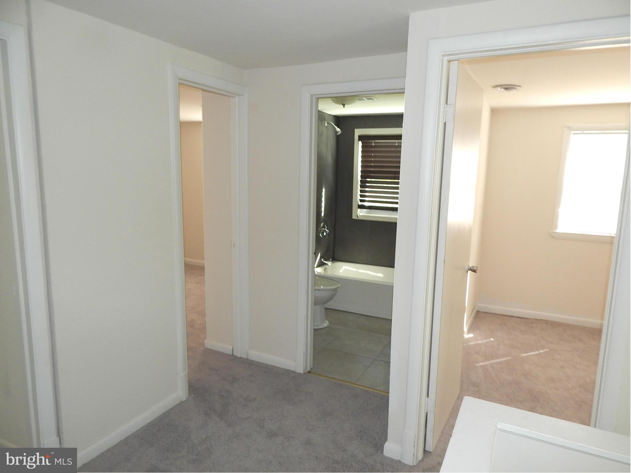 12 Crafton Road Baltimore, MD 21221 - Photo 15 of 28 a view of a bathroom from a hallway