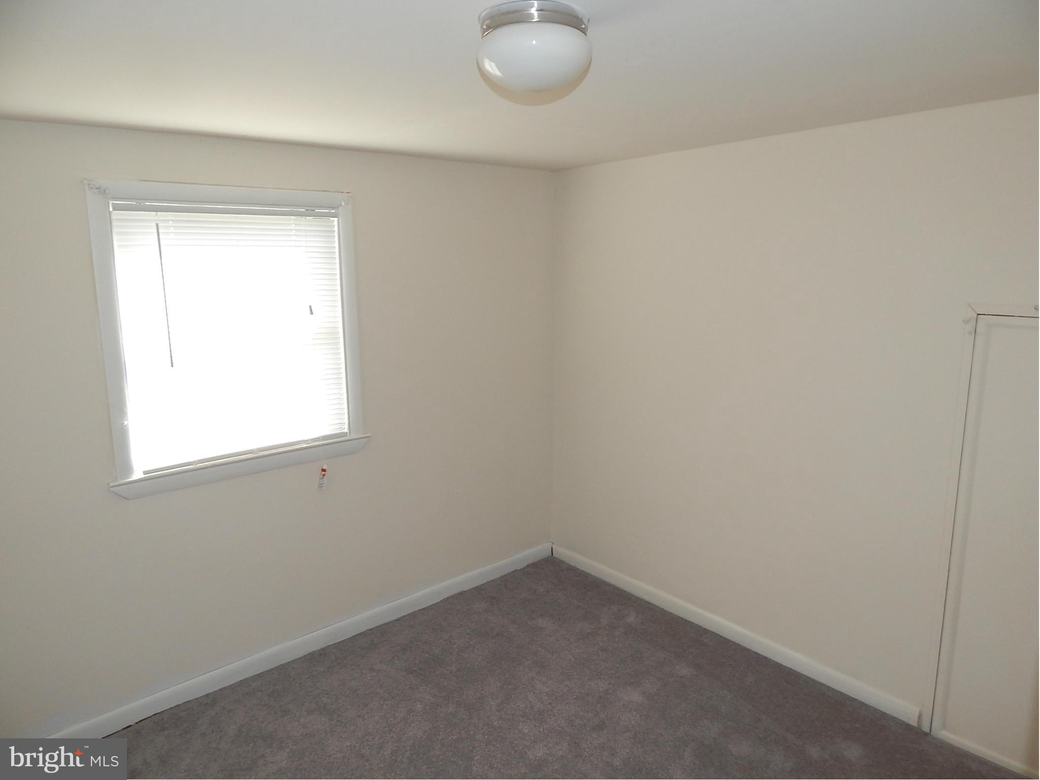 12 Crafton Road Baltimore, MD 21221 - Photo 16 of 28 an empty room with a window