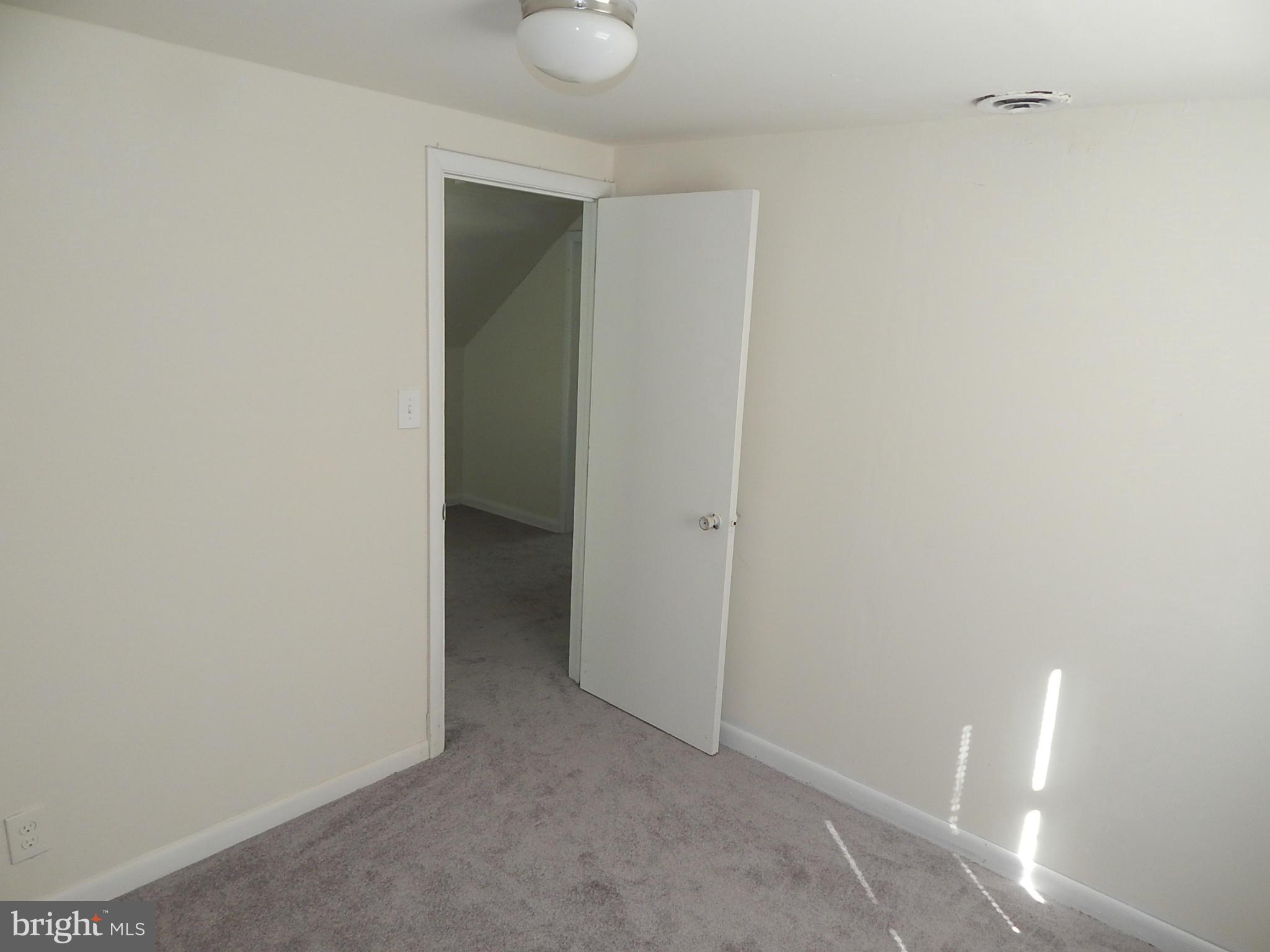 12 Crafton Road Baltimore, MD 21221 - Photo 17 of 28 a view of an empty room