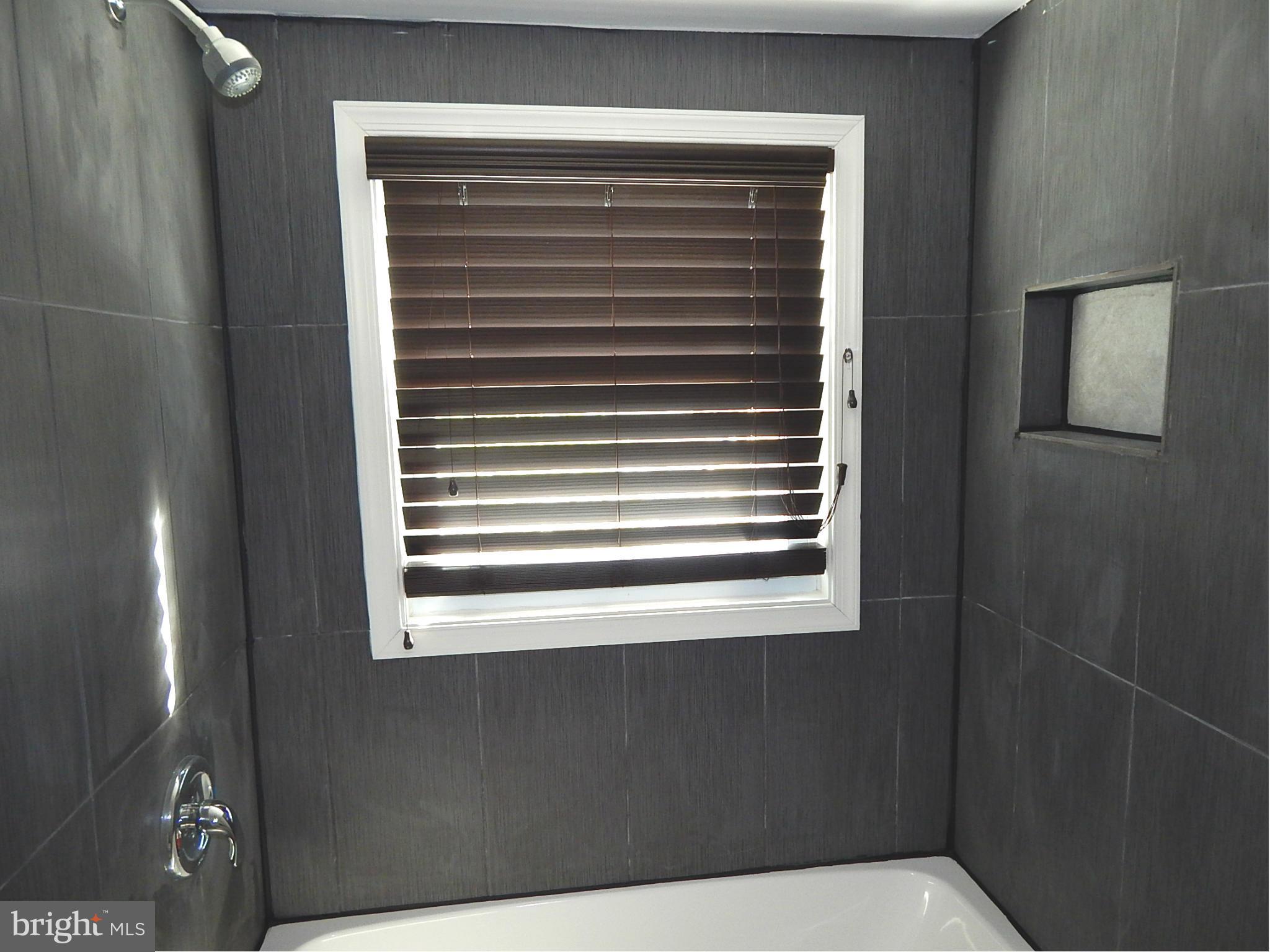 12 Crafton Road Baltimore, MD 21221 - Photo 19 of 28 a view of a room that has a window in it