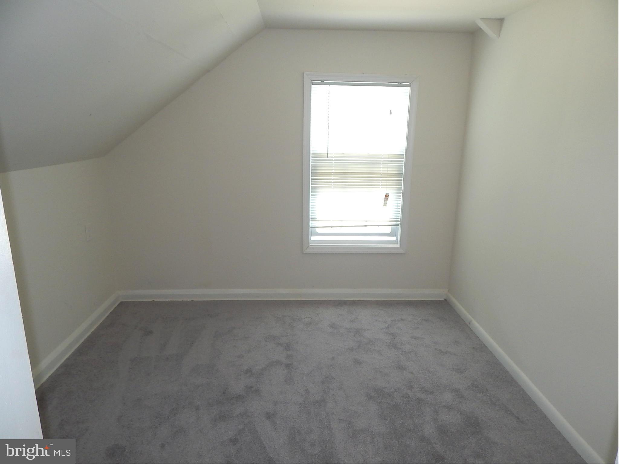 12 Crafton Road Baltimore, MD 21221 - Photo 22 of 28 an empty room with a window