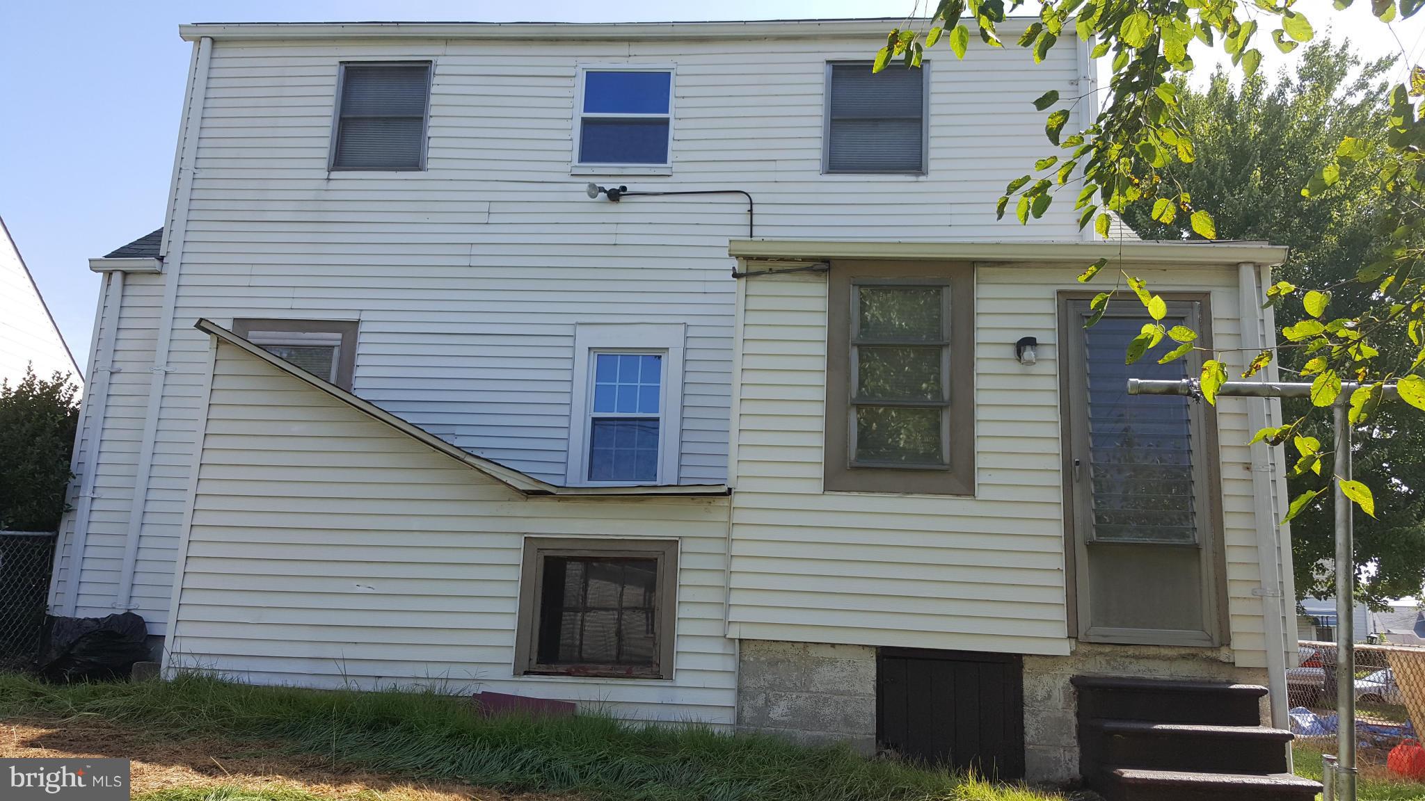 12 Crafton Road Baltimore, MD 21221 - Photo 26 of 28 a view of a house with a yard and potted plants