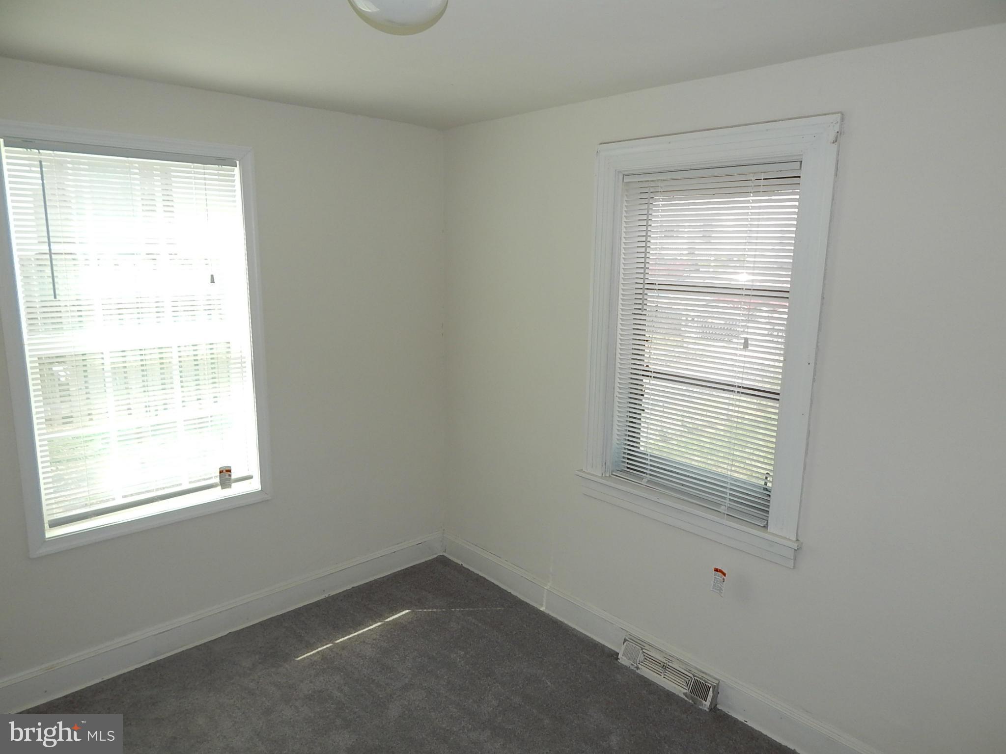 12 Crafton Road Baltimore, MD 21221 - Photo 7 of 28 an empty room with a window