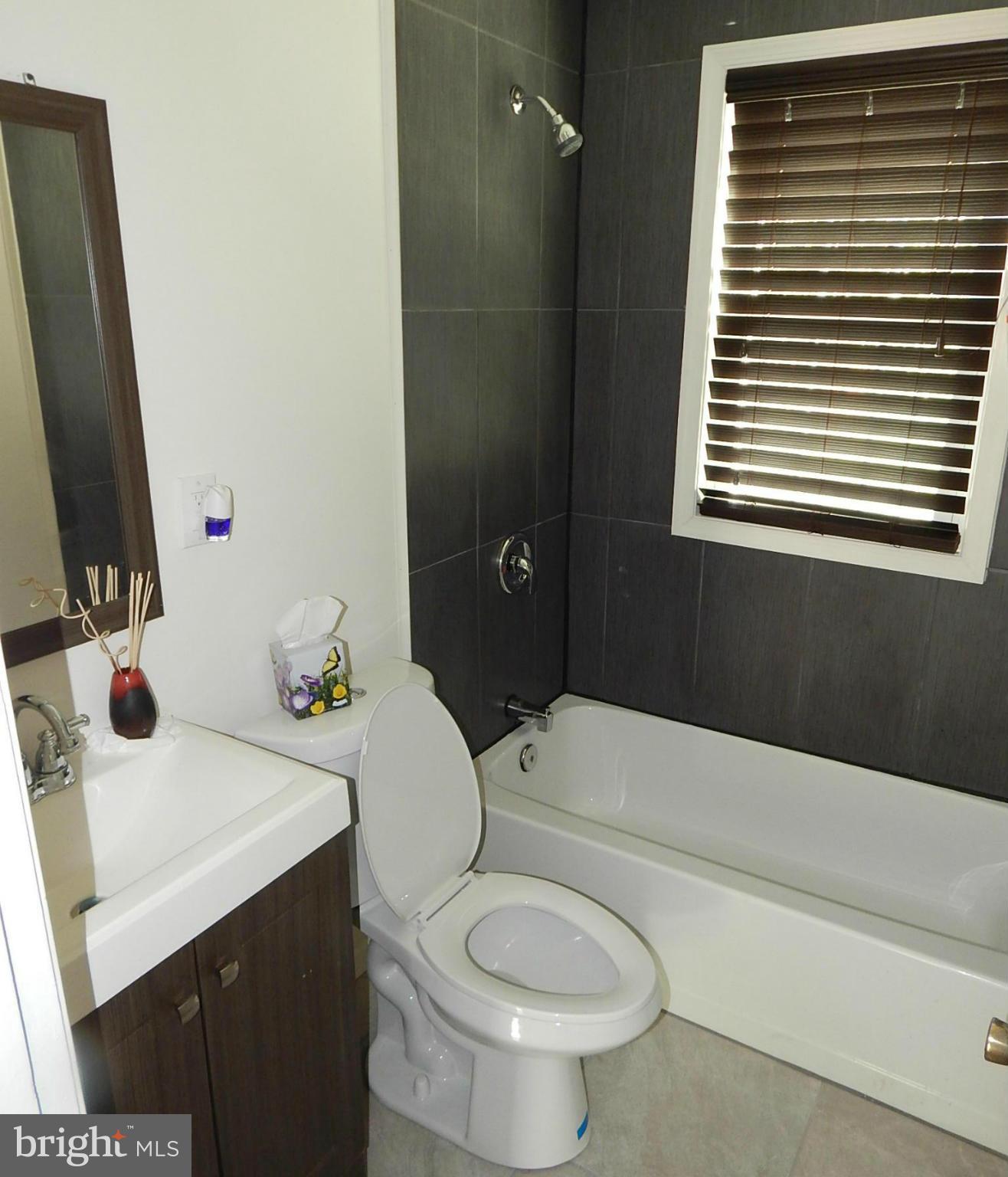 12 Crafton Road Baltimore, MD 21221 - Photo 9 of 28 a bathroom with a sink a toilet and bathtub