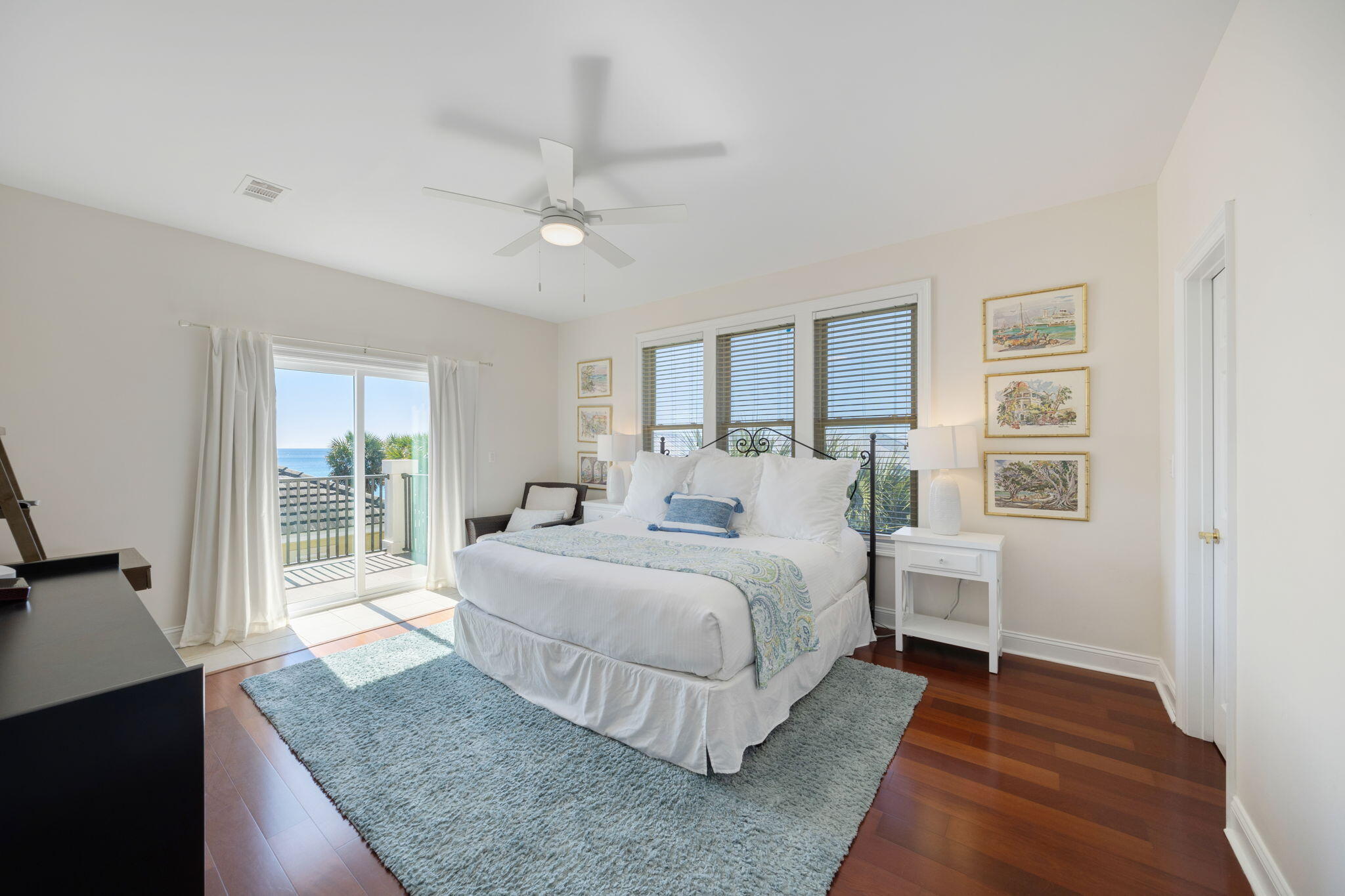 44 South Grande Beach Drive Santa Rosa Beach, FL 32459 - Photo 29 of 68 a spacious bedroom with a bed and wooden floor