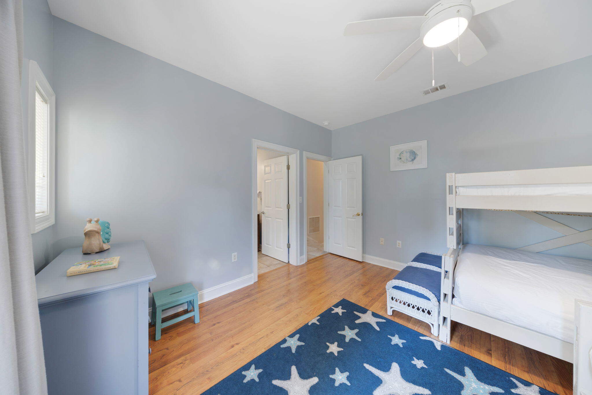 44 South Grande Beach Drive Santa Rosa Beach, FL 32459 - Photo 58 of 68 a room with a bed and a lamp on table