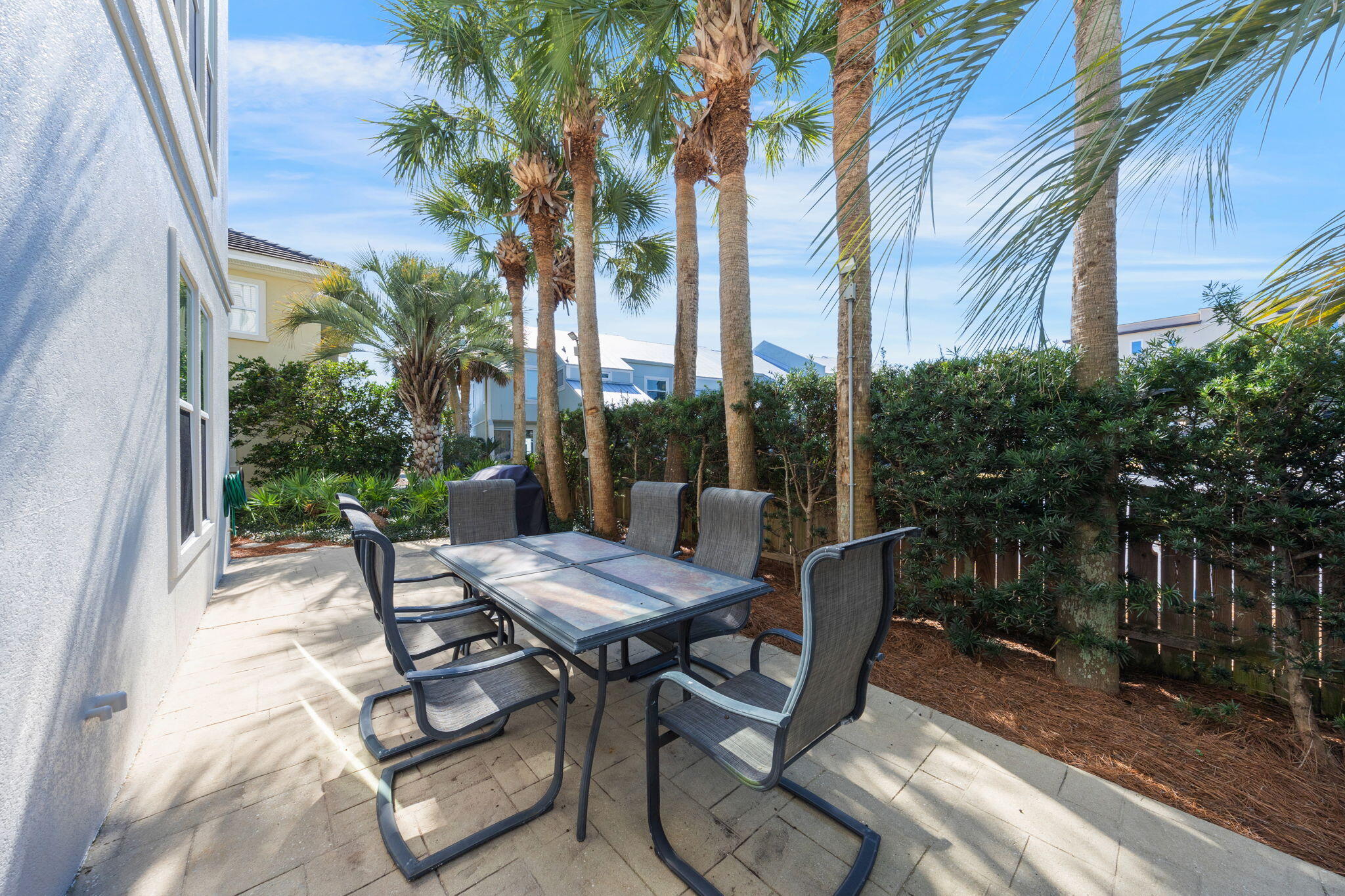 44 South Grande Beach Drive Santa Rosa Beach, FL 32459 - Photo 63 of 68 a view of a patio with table and chairs and potted plants