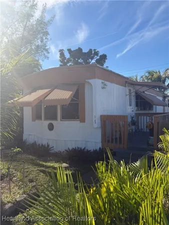 a view of a backyard with sitting area