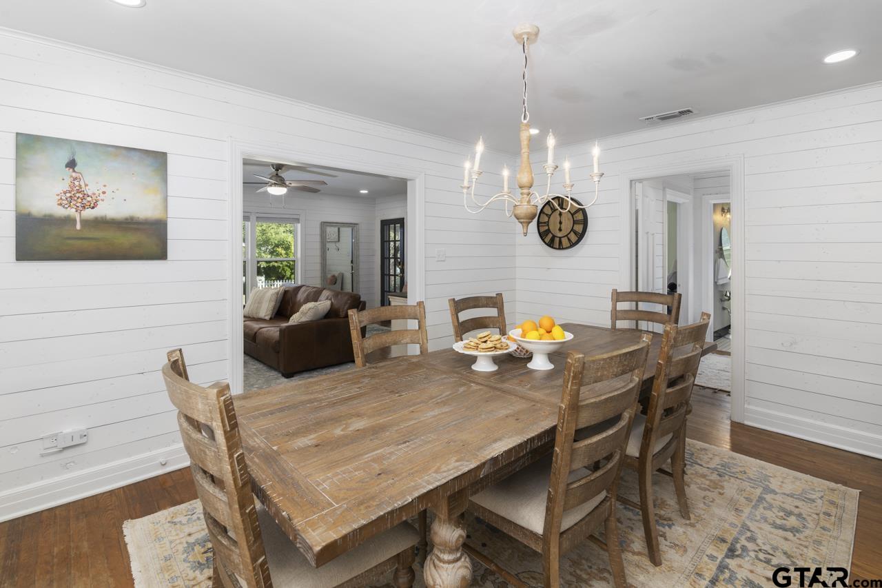 403 East Houston Street Tyler, TX 75701 - Photo 11 of 44 a view of a dining room with furniture and chandelier