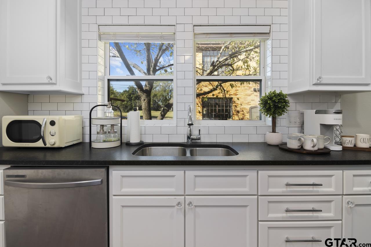 403 East Houston Street Tyler, TX 75701 - Photo 13 of 44 a kitchen with a sink and a window