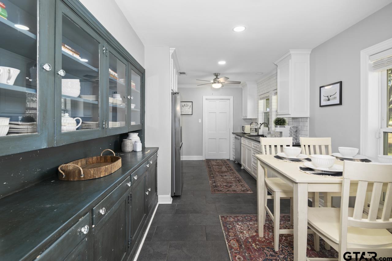 403 East Houston Street Tyler, TX 75701 - Photo 16 of 44 a kitchen with granite countertop lots of counter top space and dining table