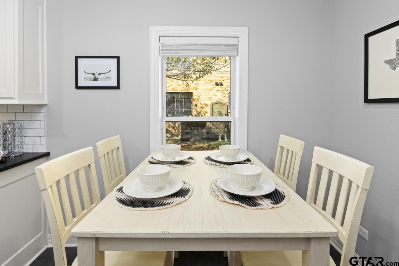 403 East Houston Street Tyler, TX 75701 - Photo 17 of 44 a view of a dining room with furniture window and wooden floor