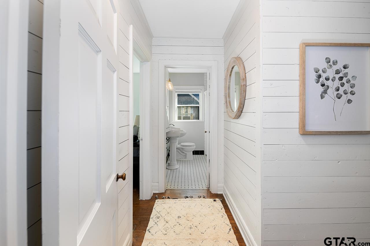 403 East Houston Street Tyler, TX 75701 - Photo 20 of 44 a bathroom with a walk in closet and mirror
