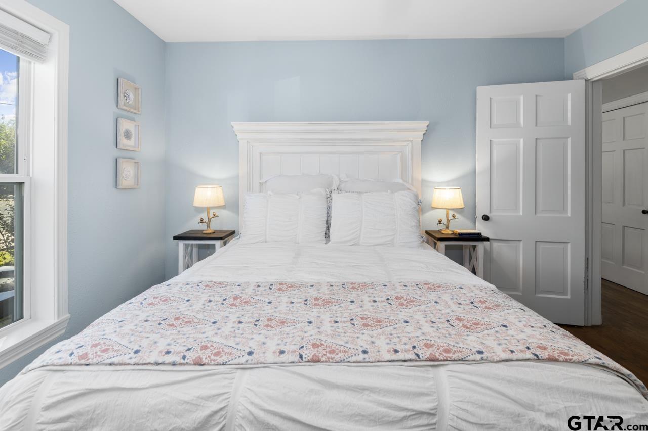 403 East Houston Street Tyler, TX 75701 - Photo 27 of 44 a large white bed in a white room
