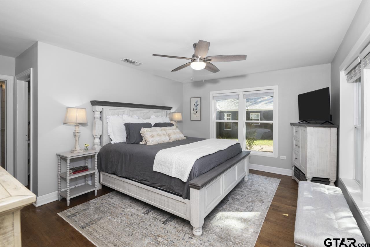 403 East Houston Street Tyler, TX 75701 - Photo 29 of 44 a bed room with a bed tv and a window