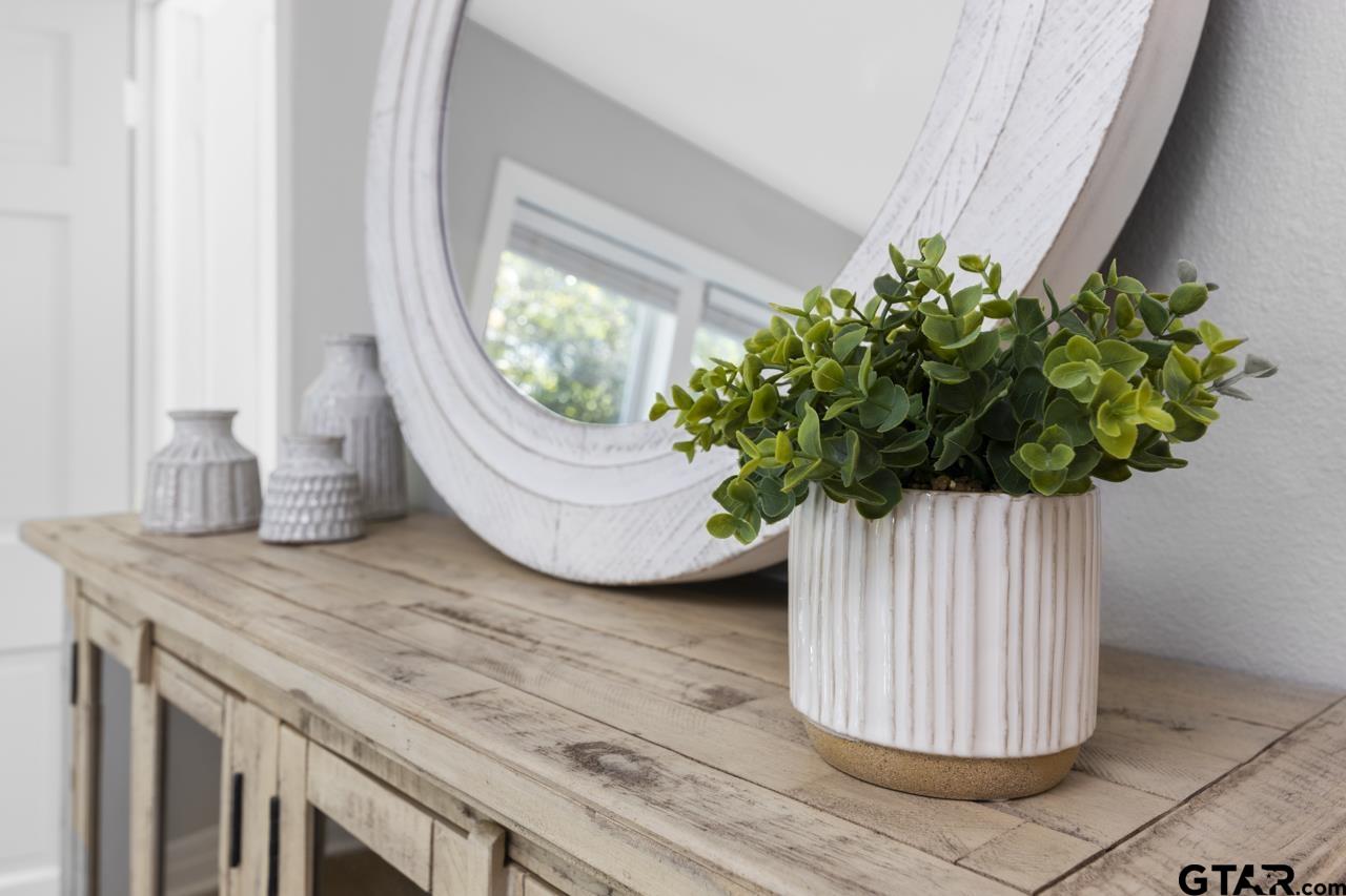 403 East Houston Street Tyler, TX 75701 - Photo 34 of 44 a vase of flowers sitting on a table