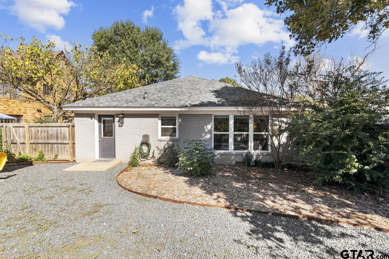 403 East Houston Street Tyler, TX 75701 - Photo 35 of 44 a front view of a house with a garden and yard