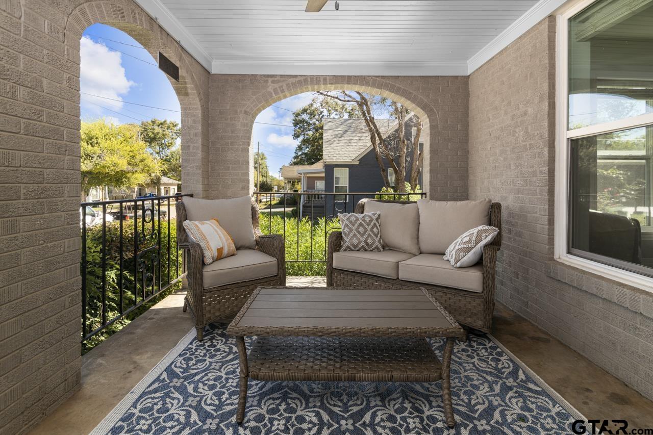 403 East Houston Street Tyler, TX 75701 - Photo 4 of 44 a living room with furniture and a large window
