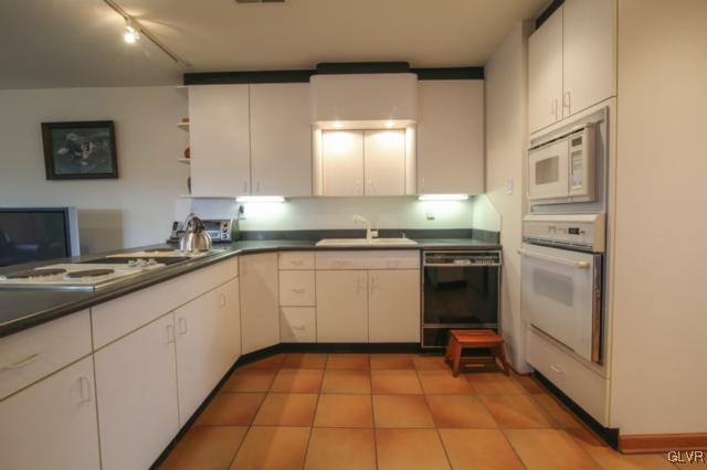 1205 Seifert Road Nazareth, PA 18064 - Photo 15 of 50 a kitchen with a sink stove and cabinets