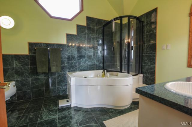 1205 Seifert Road Nazareth, PA 18064 - Photo 21 of 50 a bathroom with a bathtub and a sink