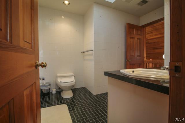1205 Seifert Road Nazareth, PA 18064 - Photo 30 of 50 a bathroom with a granite countertop toilet and a sink