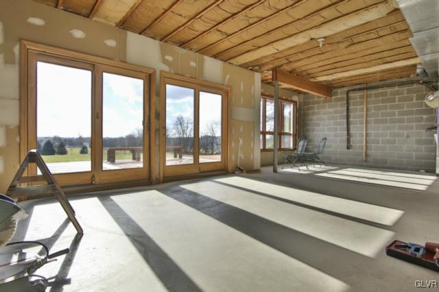 1205 Seifert Road Nazareth, PA 18064 - Photo 35 of 50 a spacious bedroom with a large bed and a large window