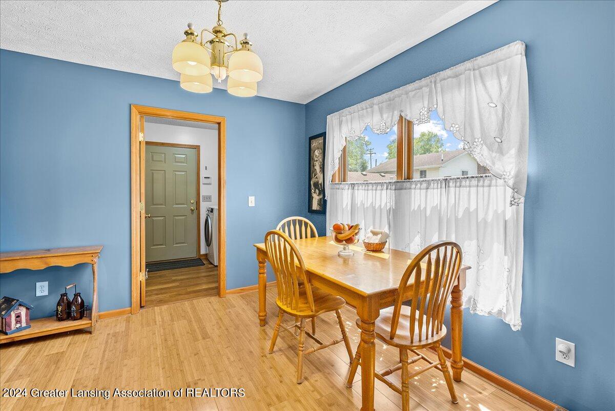 1645 North Aurelius Road Holt, MI 48842 - Photo 13 of 33 Dining room, laundry leading to garage