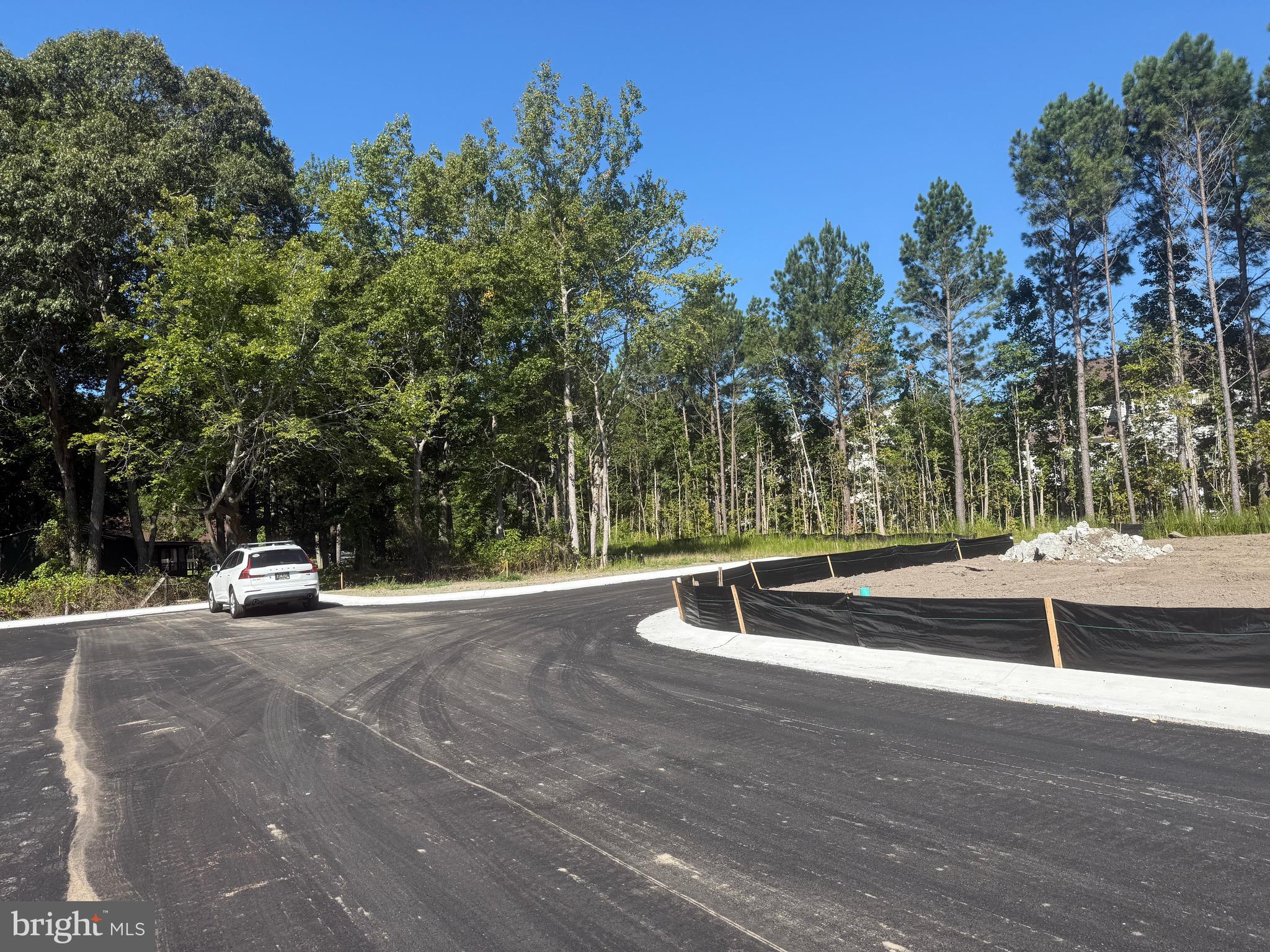 36038 Jackson Street Ocean View, DE 19970 - Photo 5 of 7 a view of a swimming pool with a yard
