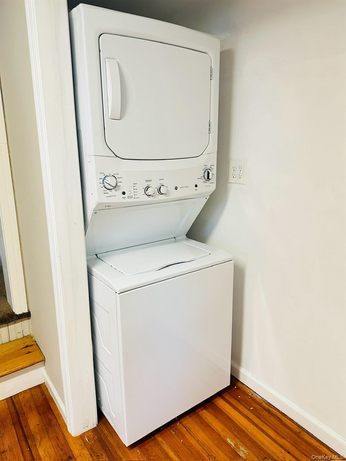 181 Mansion Street, Unit 2 Poughkeepsie, NY 12601 - Photo 6 of 20 Laundry room with stacked washer / drying machine and hardwood / wood-style flooring