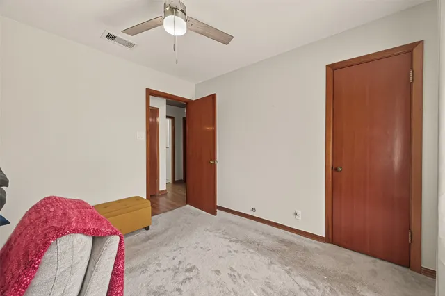 a workspace with wooden floor and a window