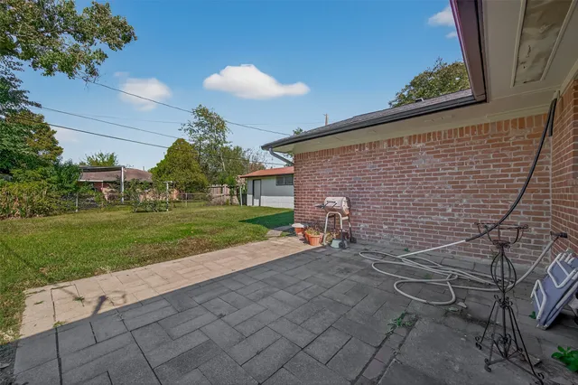 a backyard of a house with seating space