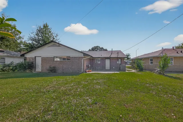 a front view of house with yard and outdoor seating