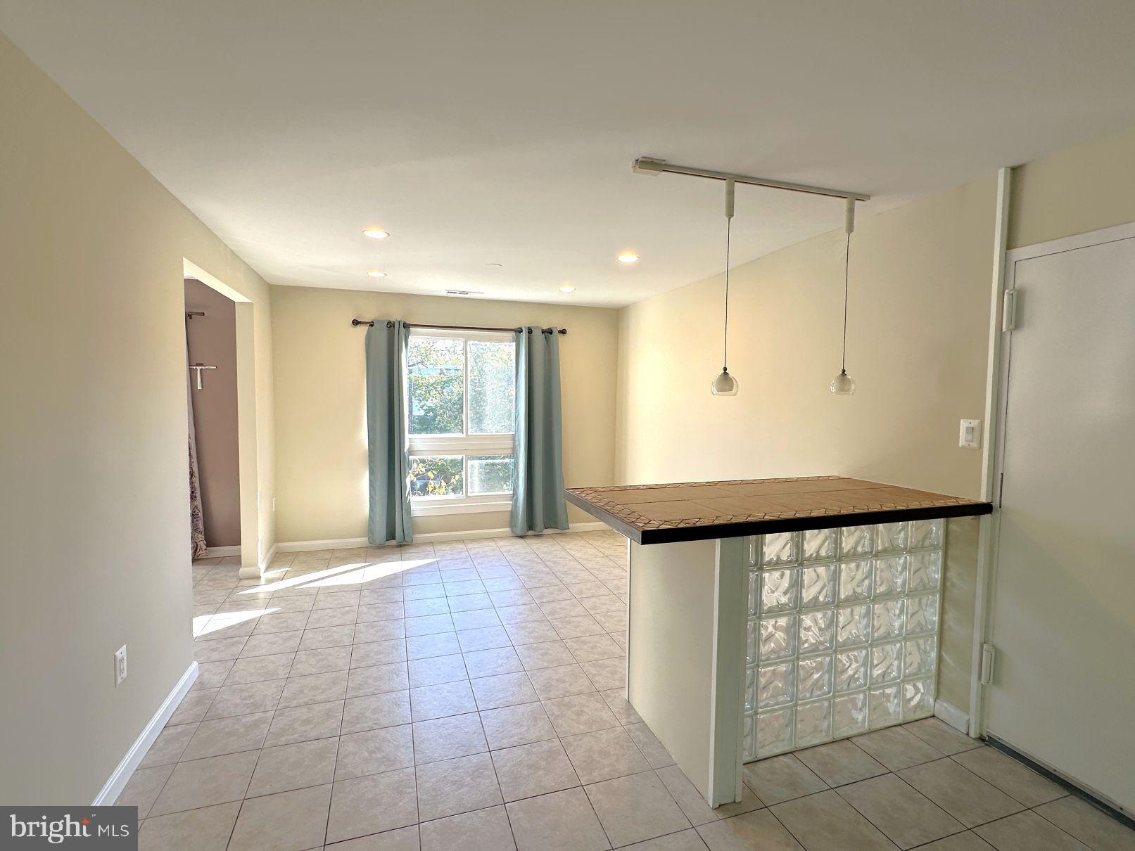 3940 Bel Pre Road, Unit 39408 Silver Spring, MD 20906 - Photo 1 of 24 3940 Bel Pre #8- Dining area w/bar