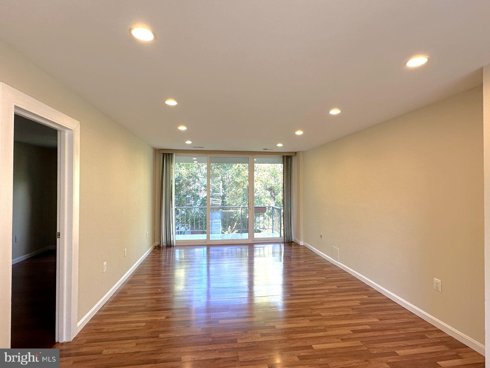 3940 Bel Pre Road, Unit 39408 Silver Spring, MD 20906 - Photo 13 of 24 Living room w/ 2nd bedroom to left