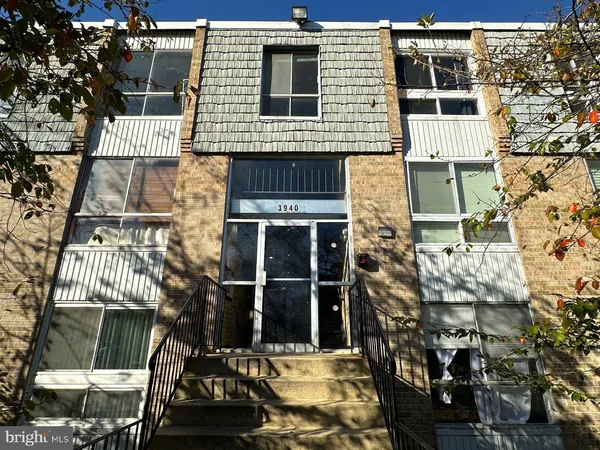 a view of a house with a door and balcony