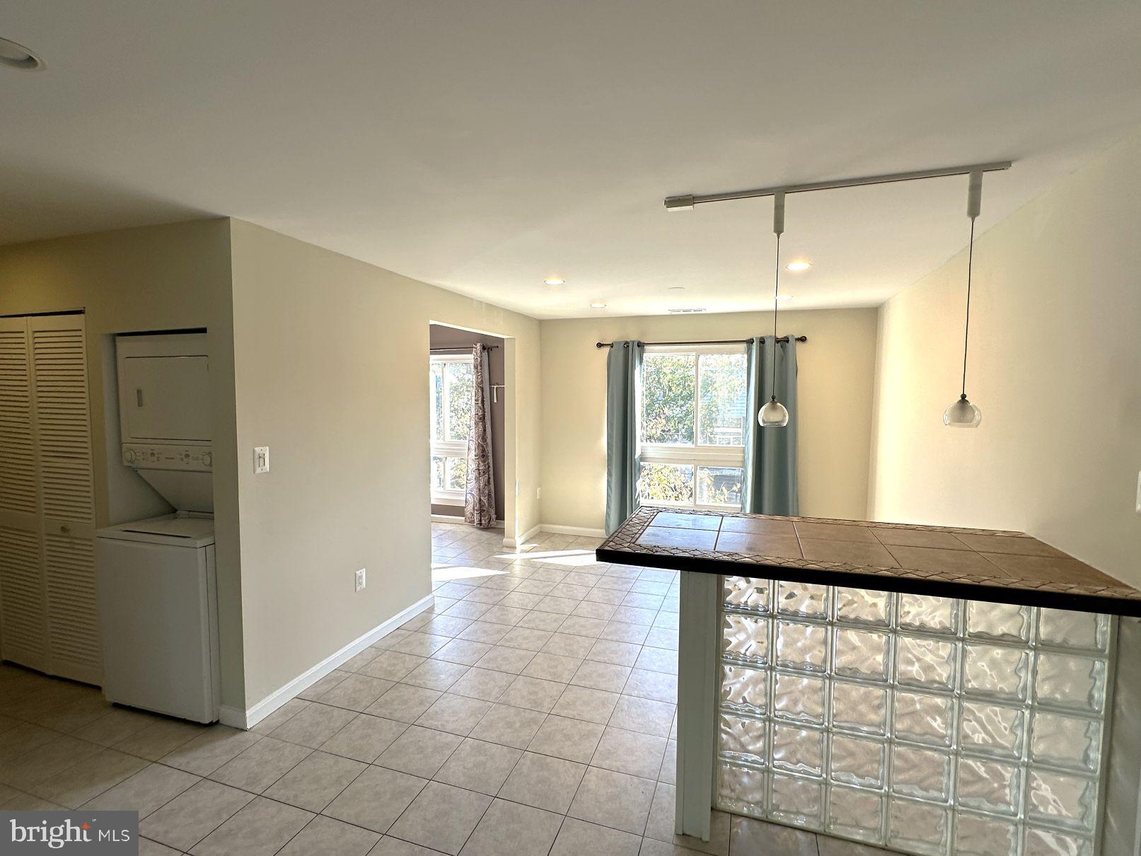 3940 Bel Pre Road, Unit 39408 Silver Spring, MD 20906 - Photo 7 of 24 Looking into dining area from front door