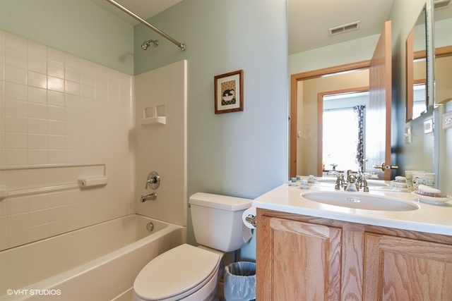 13509 Delaney Road Huntley, IL 60142 - Photo 14 of 15 a bathroom with a sink a toilet and shower
